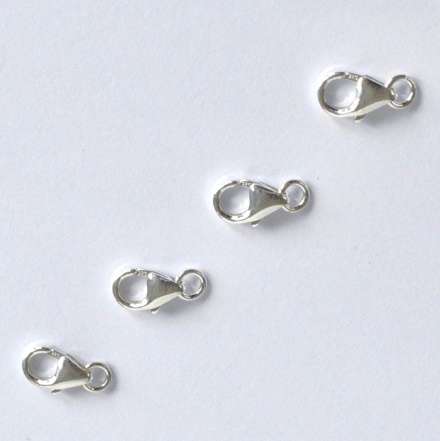 925 Sterling Silver lobster clasps on a white background