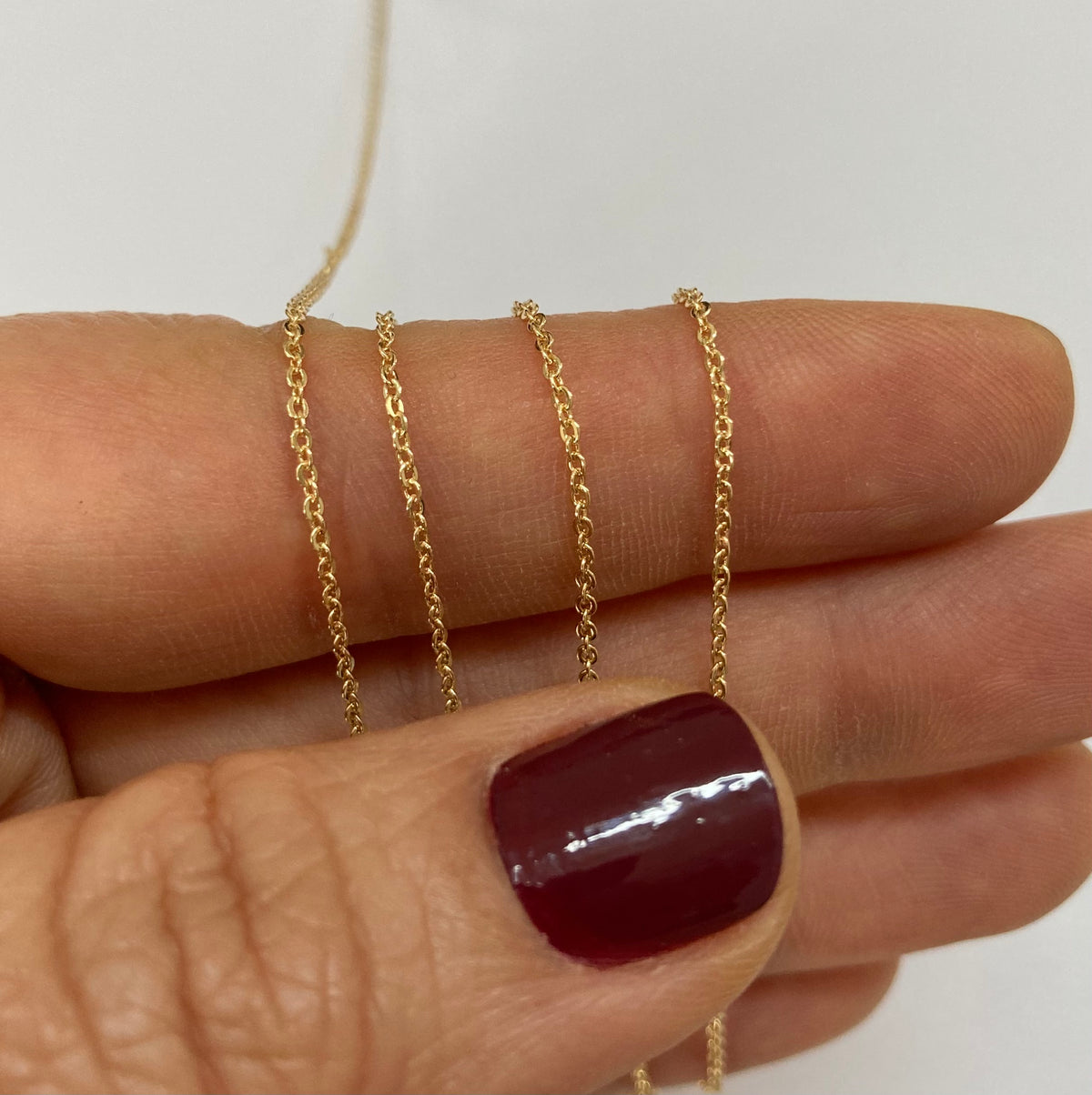 Gold filled flat cable chain on a hand