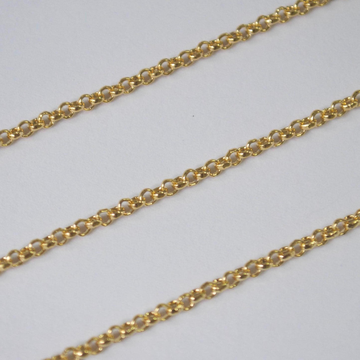Gold filled 2mm rolo chain on a light gray background