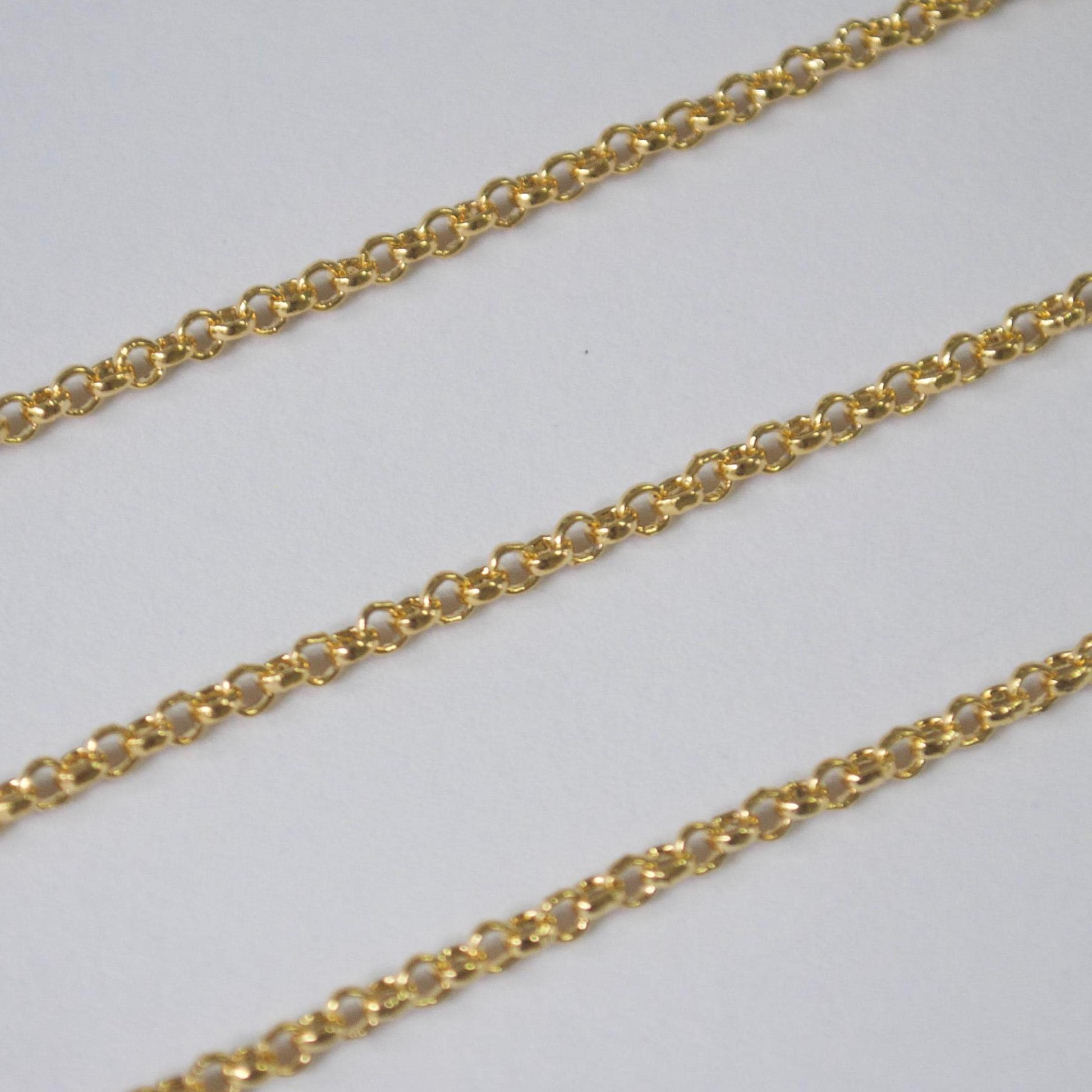 Gold filled 2mm rolo chain on a light gray background