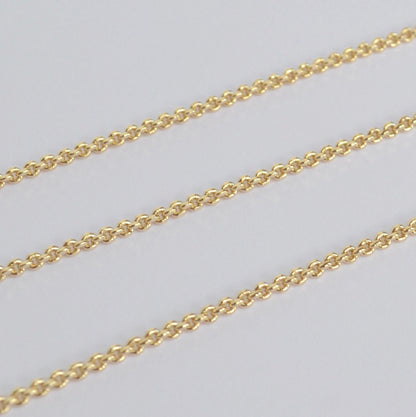 Gold filled thick chain on a light gray background