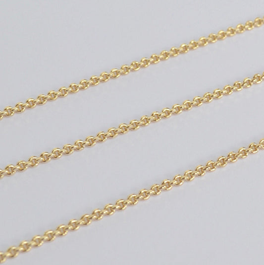Gold filled thick chain on a light gray background