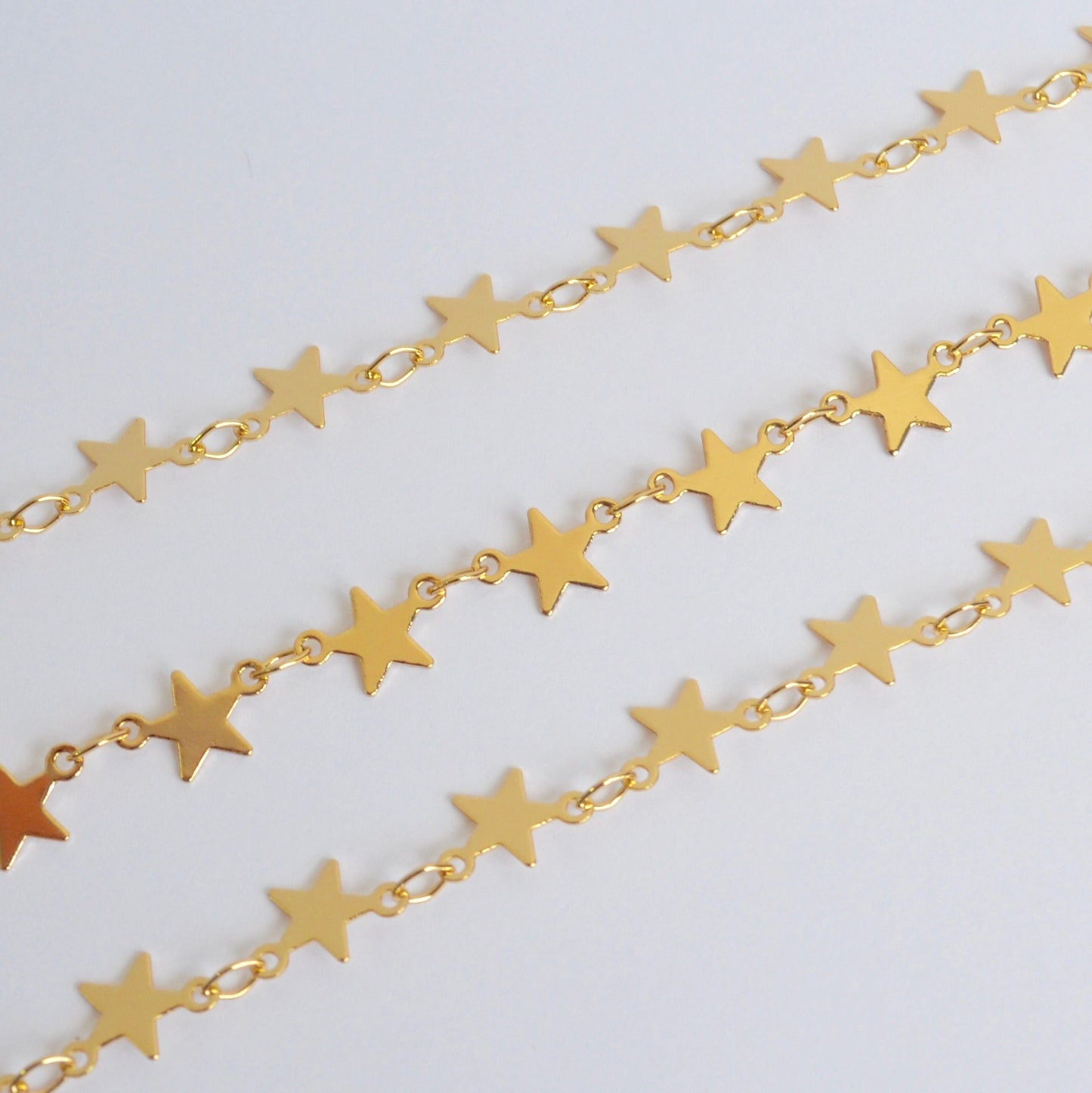 Gold filled star chain close up detail showing star links by the foot